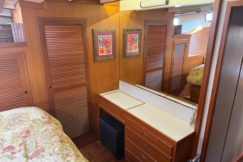 Slide: The Image of 1998 Kadey-Krogen 48' Northsea Widebody Pilothouse interior with wood paneling and floral decor. - 20