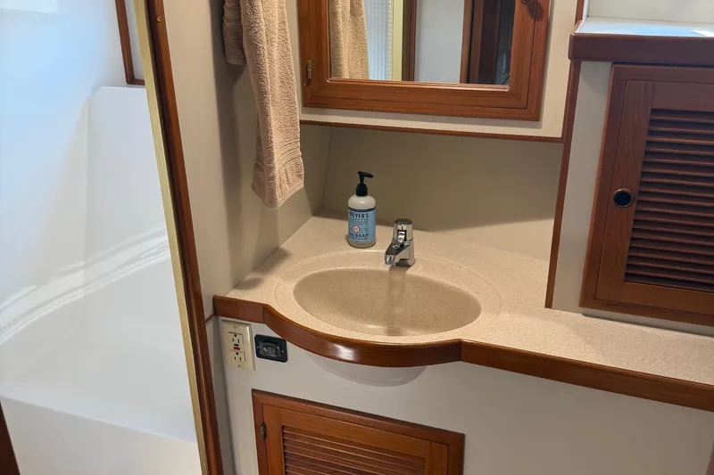 Slide: The Image of Bathroom sink area in 1998 Kadey-Krogen 48' Northsea Widebody Pilothouse yacht. - 23