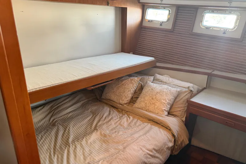 Slide: The Image of Cozy cabin interior of 1998 Kadey-Krogen 48' Northsea Widebody Pilothouse with bunk beds. - 27