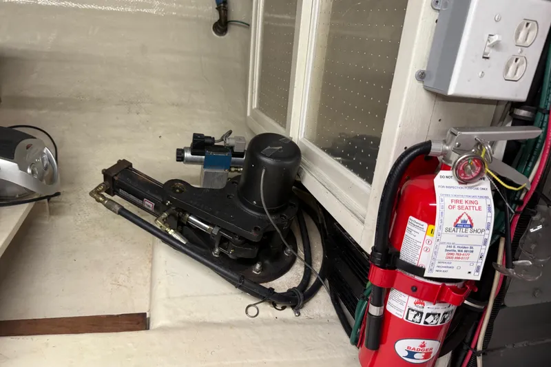 Slide: The Image of Engine room of 1998 Kadey-Krogen 48' Northsea Widebody Pilothouse with fire extinguisher. - 34