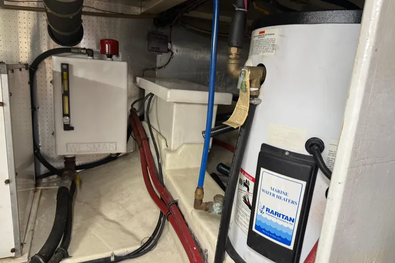 Slide: The Image of Engine room of 1998 Kadey-Krogen 48' Northsea with marine water heater and equipment. - 36