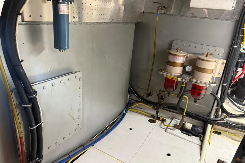 Slide: The Image of Engine room of 1998 Kadey-Krogen 48' Northsea Widebody Pilothouse with fuel filters and wiring. - 37