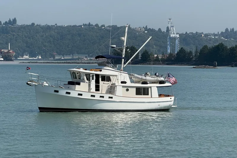 Slide: The Image of 1998 Kadey-Krogen 48' Northsea Widebody Pilothouse yacht on calm water. - 39