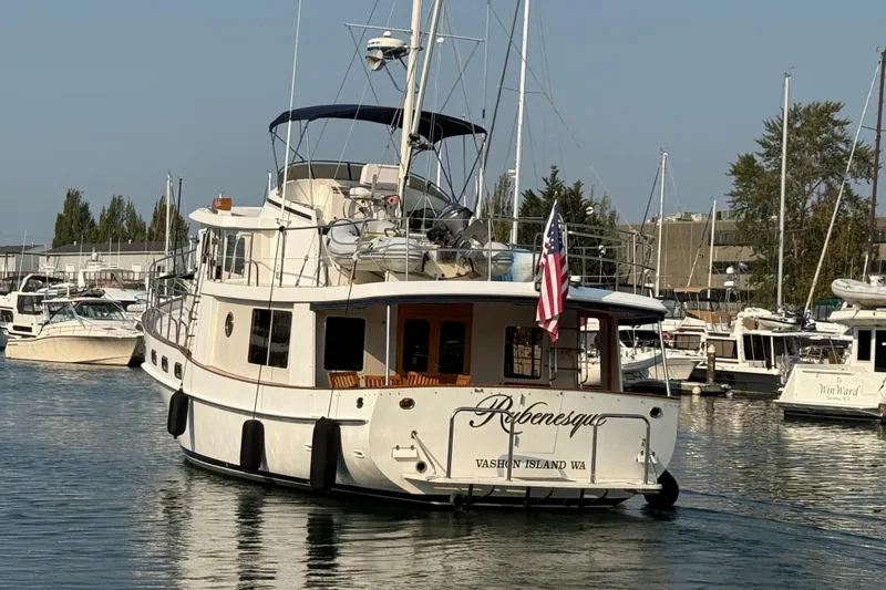 Slide: The Image of 1998 Kadey-Krogen 48' Northsea Widebody Pilothouse yacht docked in marina, rear view. - 42