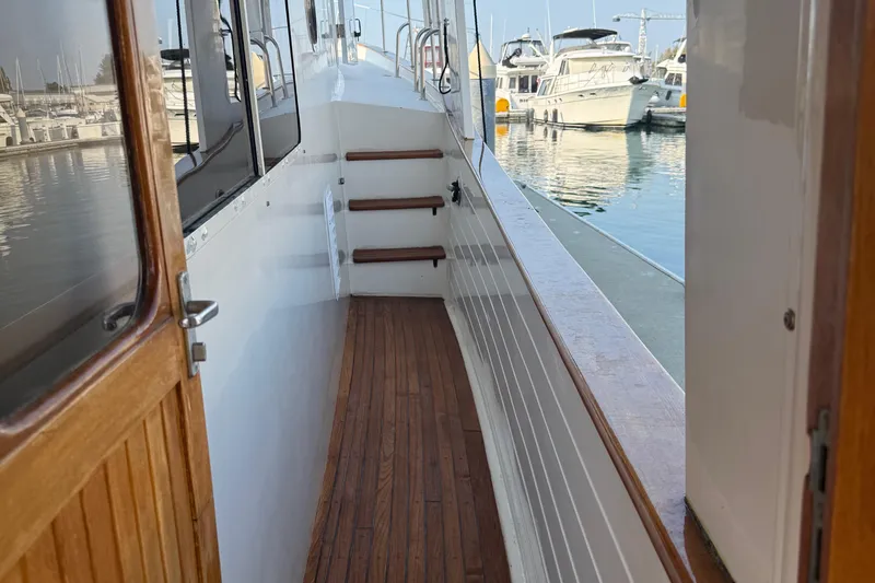 Slide: The Image of Kadey-Krogen 48' Northsea Widebody Pilothouse, 1998, wooden deck, marina view. - 5