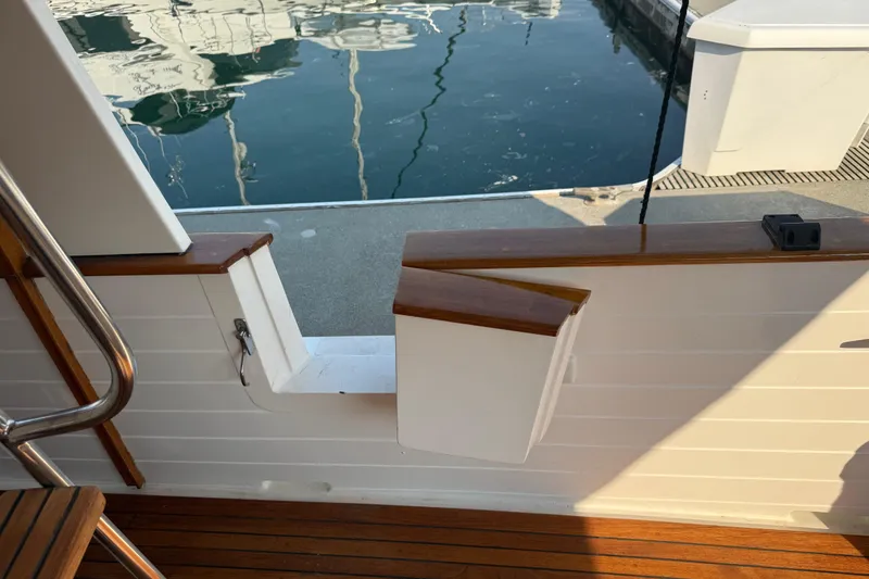 Slide: The Image of Kadey-Krogen 48' Northsea Widebody Pilothouse, 1998, dockside view with wooden deck and open gate. - 6