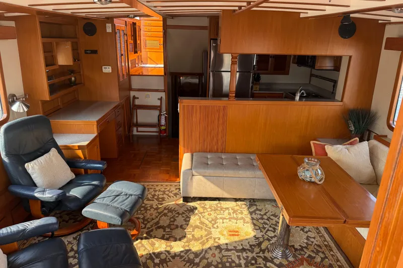 Slide: The Image of Interior of 1998 Kadey-Krogen 48' Northsea Widebody Pilothouse with cozy seating and wooden finishes. - 9