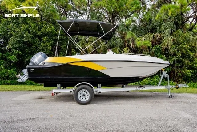 Slide: The Image of 2022 Starcraft SVX 191 OB boat on trailer, featuring a sleek design and canopy. - 0