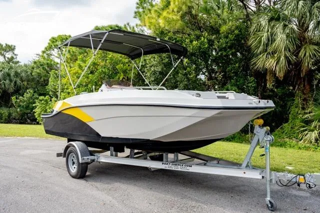 Slide: The Image of 2022 Starcraft SVX 191 OB boat on trailer, featuring sleek design and canopy. - 4