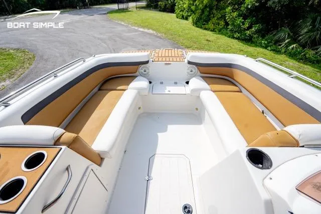 Slide: The Image of 2022 Starcraft SVX 191 OB boat interior with tan seating and cup holders. - 8