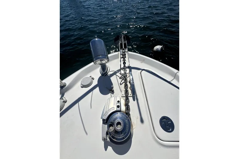 Slide: The Image of Bow of 2002 Sea Ray 340 Sundancer with anchor chain and winch, on water. - 19