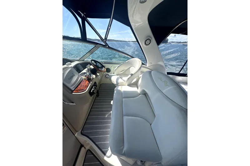 Slide: The Image of Interior view of 2002 Sea Ray 340 Sundancer boat with helm and seating. - 7