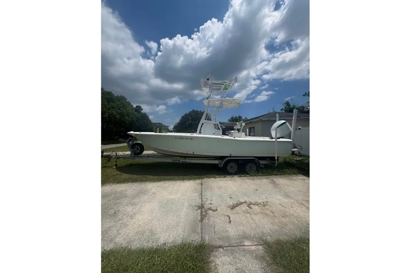 Slide: The Image of 2016 Sea Hunt BX 24 BR boat on trailer under cloudy sky. - 3