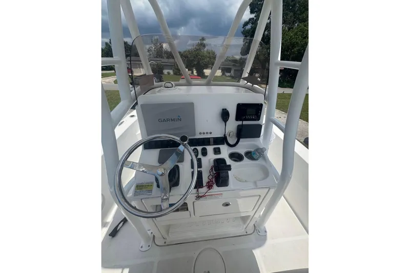 Slide: The Image of 2016 Sea Hunt BX 24 BR boat console with Garmin navigation system and steering wheel. - 5