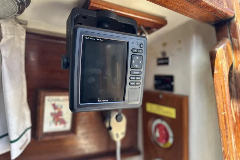 Slide: The Image of Garmin GPS device inside 1982 Cape Dory 30 sailboat cabin, mounted on wooden panel. - 19