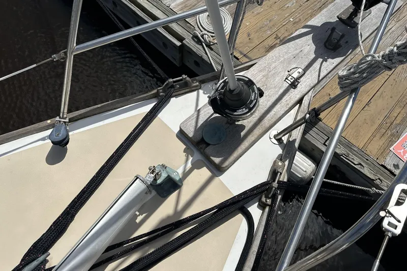 Slide: The Image of 1982 Cape Dory 30 sailboat deck with rigging and dock view. - 24