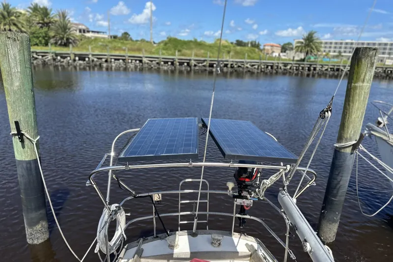 Slide: The Image of Sailboat with solar panels docked, Cape Dory 30, 1982 model, sunny day. - 27