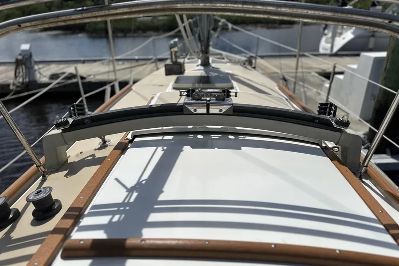 Slide: The Image of Deck view of a 1982 Cape Dory 30 sailboat at a marina. - 34