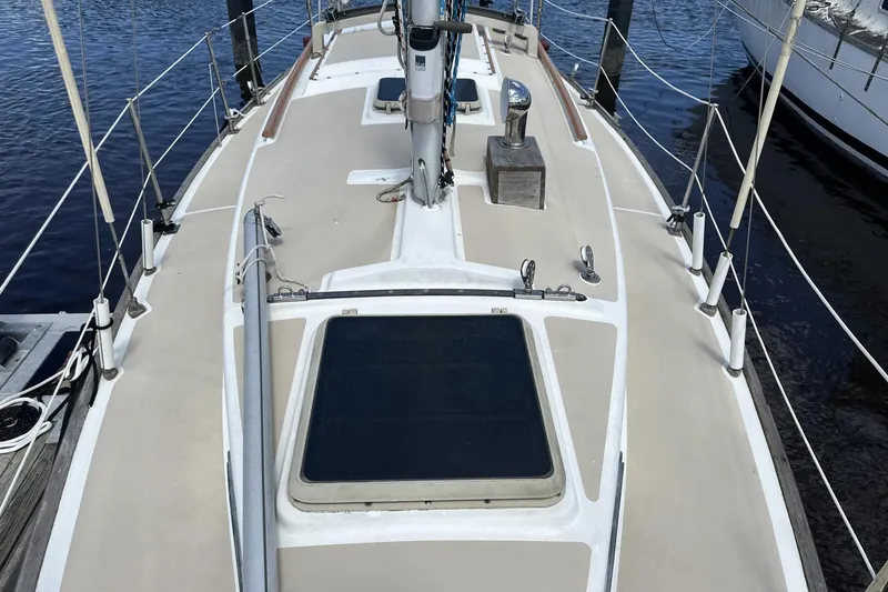 Slide: The Image of 1982 Cape Dory 30 sailboat deck view with rigging and hatches. - 4