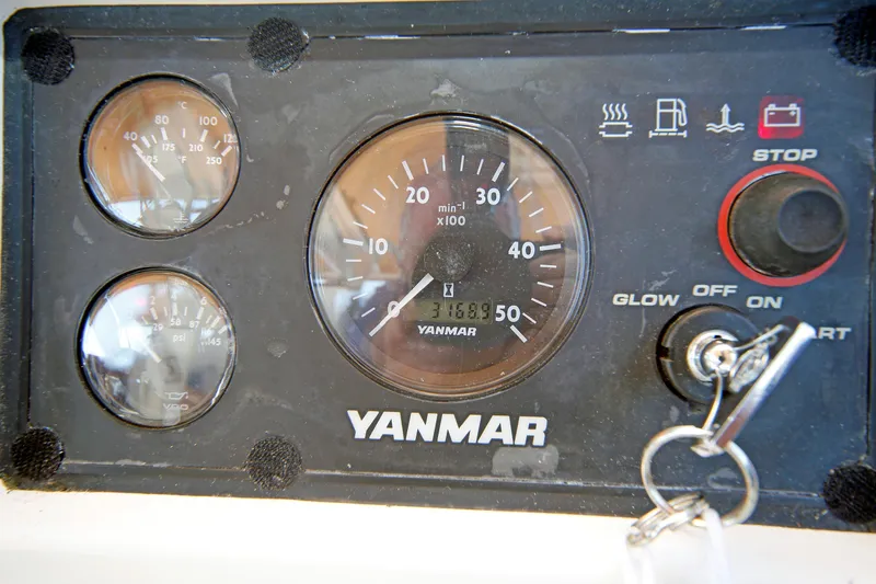 Slide: The Image of Yanmar engine control panel with gauges and ignition key, Hylas 49CC 2012 model. - 100