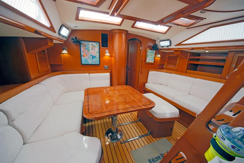 Slide: The Image of Luxurious interior of 2012 Hylas 49CC yacht with elegant wood and white seating. - 103