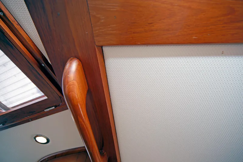 Slide: The Image of Interior of 2012 Hylas 49CC yacht with wooden trim and textured wall panel. - 118