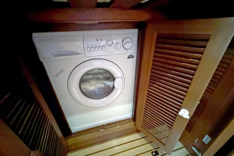 Slide: The Image of Washing machine in wooden cabinet on 2012 Hylas 49CC yacht. - 126