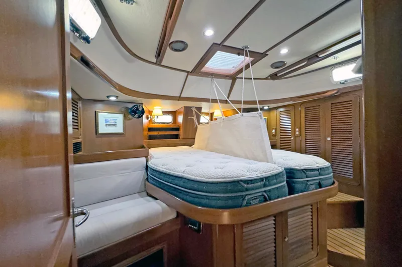 Slide: The Image of Luxurious 2012 Hylas 49CC yacht interior with cozy cabin and elegant wood finishes. - 128