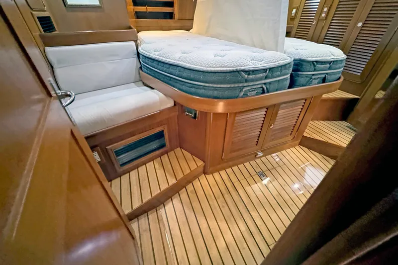 Slide: The Image of Luxurious 2012 Hylas 49CC yacht interior with wooden flooring and comfortable seating. - 130