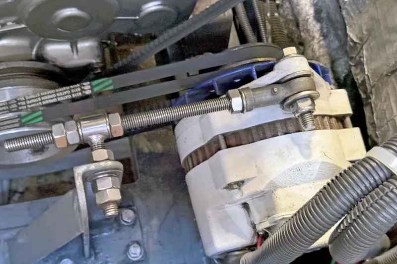 Slide: The Image of Engine components of a 2012 Hylas 49CC with visible belts and wiring. - 150