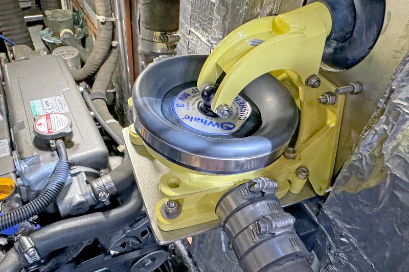 Slide: The Image of Engine compartment of a 2012 Hylas 49CC with mechanical components and hoses. - 152