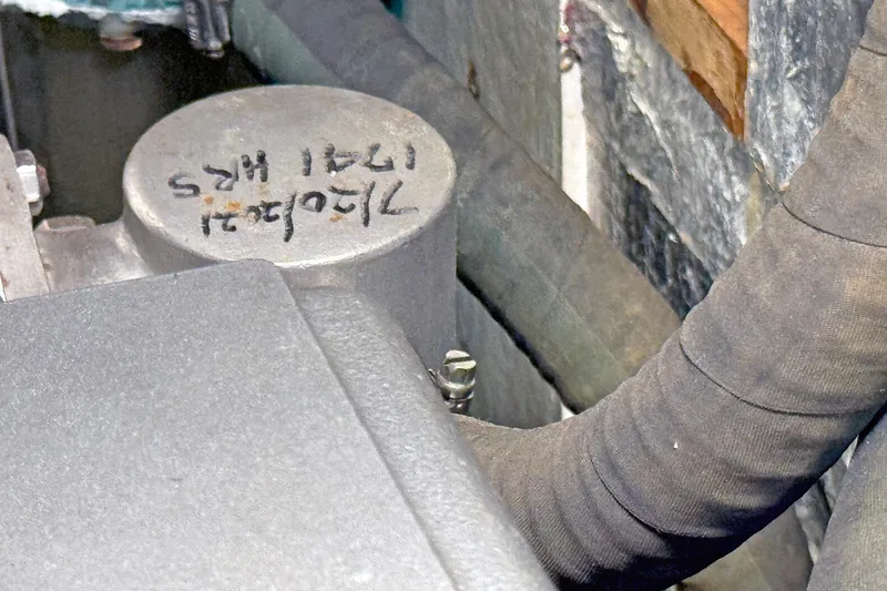 Slide: The Image of Close-up of Hylas 49CC engine component with handwritten markings, 2012 model. - 153