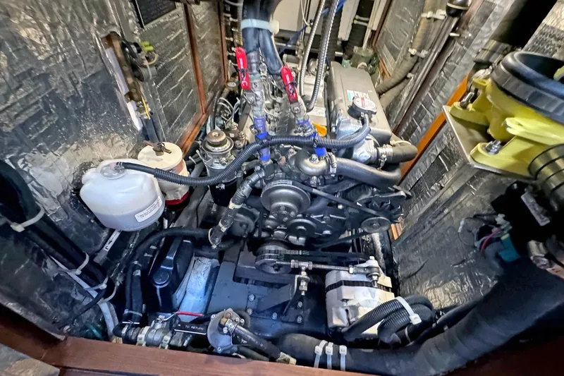 Slide: The Image of Engine compartment of a 2012 Hylas 49CC yacht, showcasing detailed mechanical components. - 155