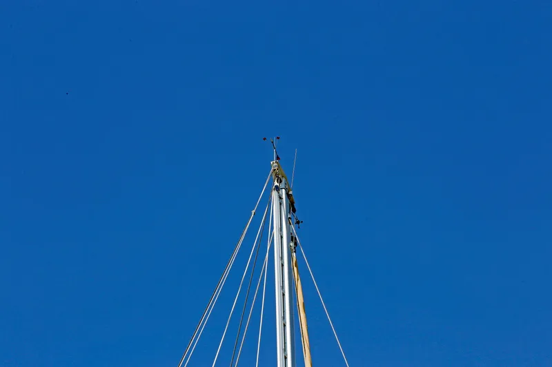 Slide: The Image of Mast of 2012 Hylas 49CC sailboat against clear blue sky. - 16