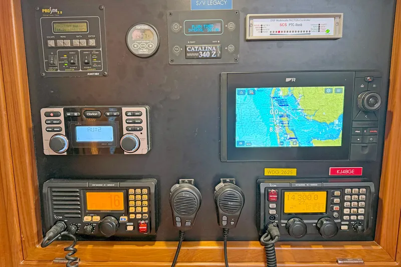 Slide: The Image of Navigation and communication equipment on a 2012 Hylas 49CC yacht control panel. - 162