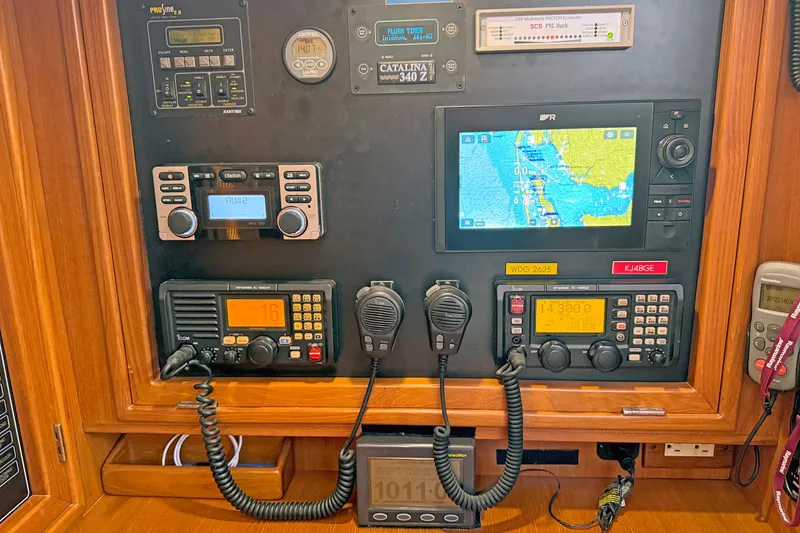 Slide: The Image of Control panel of a 2012 Hylas 49CC yacht with navigation and communication equipment. - 163