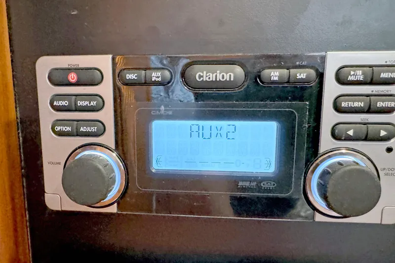 Slide: The Image of Clarion car stereo system displaying AUX2 mode, Hylas 49CC, 2012 model. - 168