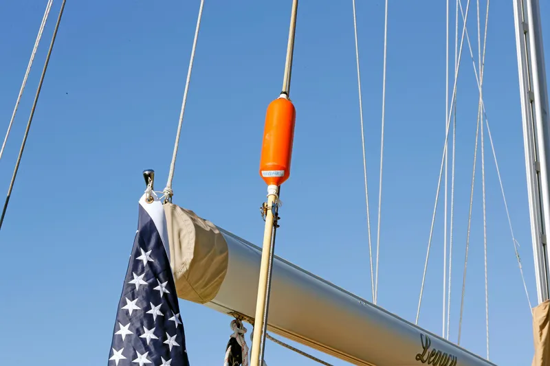 Slide: The Image of Sailboat mast with American flag and orange buoy, Hylas 49CC, 2012 model. - 17
