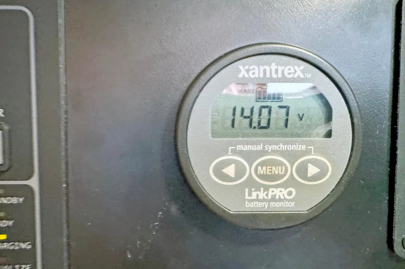 Slide: The Image of Xantrex LinkPRO battery monitor displaying 14.07 volts on Hylas 49CC, 2012 model. - 170