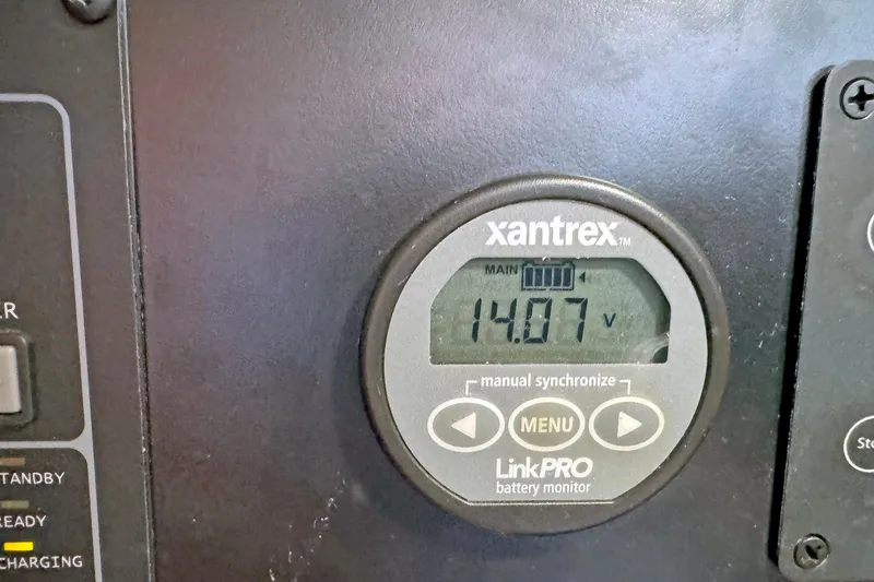 Slide: The Image of Xantrex LinkPRO battery monitor displaying 14.07 volts on a Hylas 49CC, 2012 model. - 171