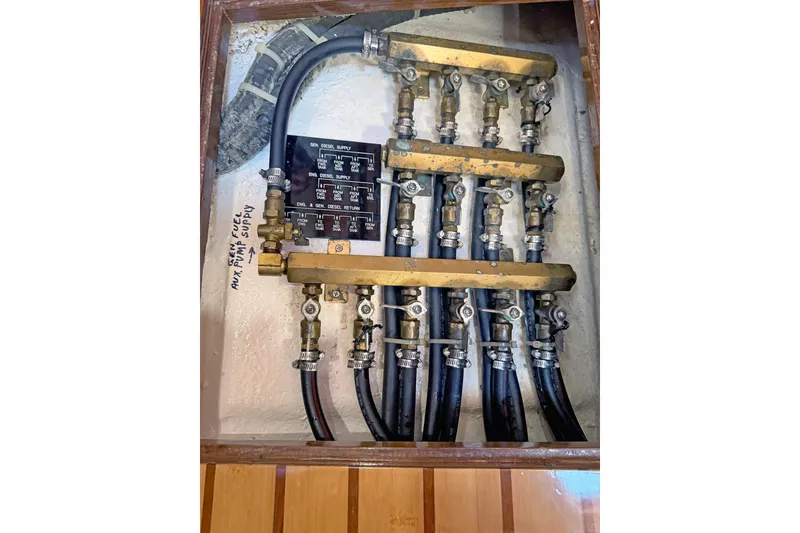 Slide: The Image of Fuel system with brass valves and hoses in a 2012 Hylas 49CC boat. - 176