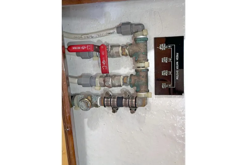 Slide: The Image of Fresh water system valves and pipes on a 2012 Hylas 49CC boat. - 177