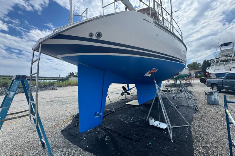 Slide: The Image of Hylas 49CC sailboat from 2012 on dry dock, undergoing maintenance with blue hull. - 185