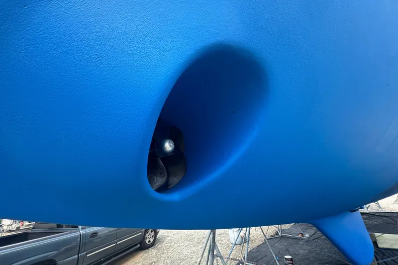 Slide: The Image of Close-up of a blue Hylas 49CC 2012 boat hull with visible propeller. - 190