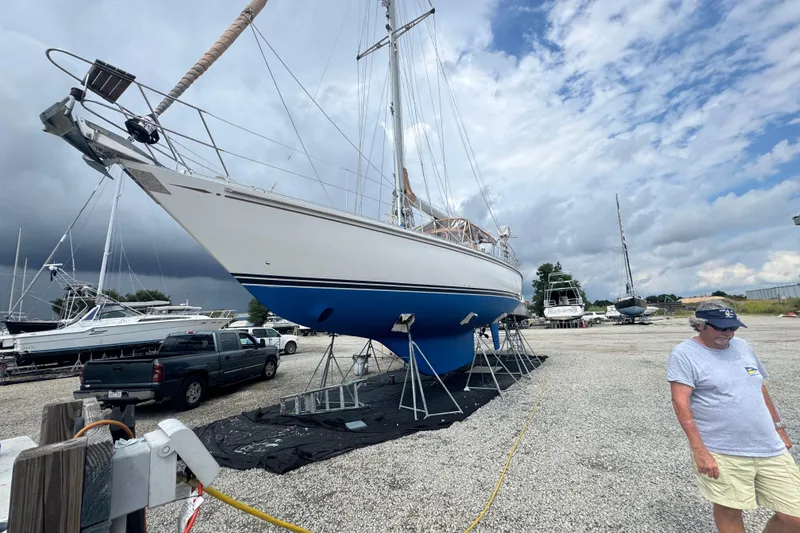 Slide: The Image of 2012 Hylas 49CC sailboat on dry dock with overcast sky. - 191