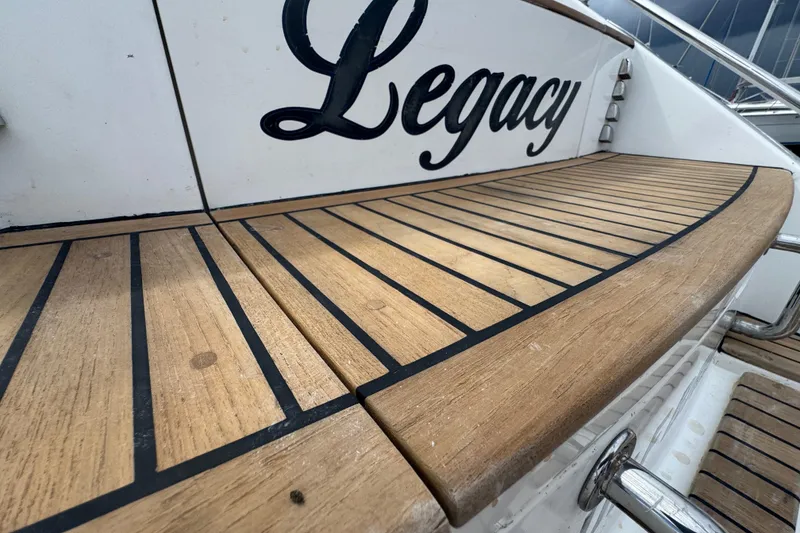 Slide: The Image of Teak deck of 2012 Hylas 49CC yacht named "Legacy" with stainless steel fittings. - 197