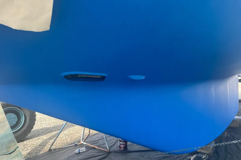 Slide: The Image of Blue hull of a 2012 Hylas 49CC sailboat on a stand. - 198