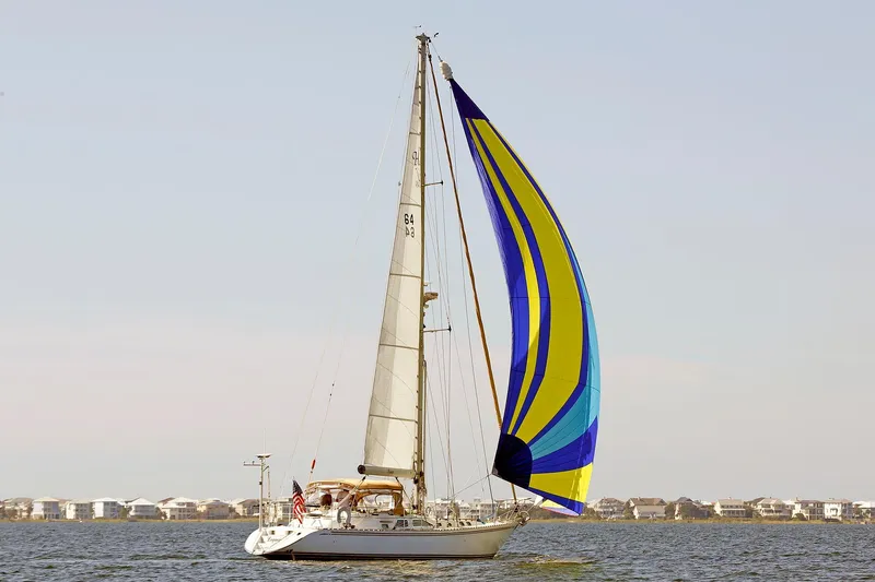Slide: The Image of Sailing yacht Hylas 49CC 2012 with colorful spinnaker on open water. - 2