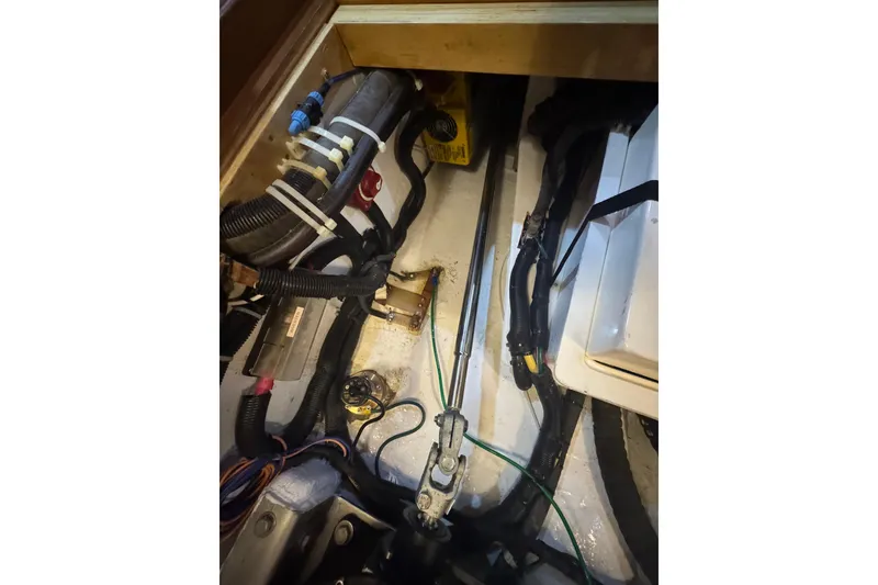 Slide: The Image of Engine compartment of a 2012 Hylas 49CC with visible wiring and components. - 205