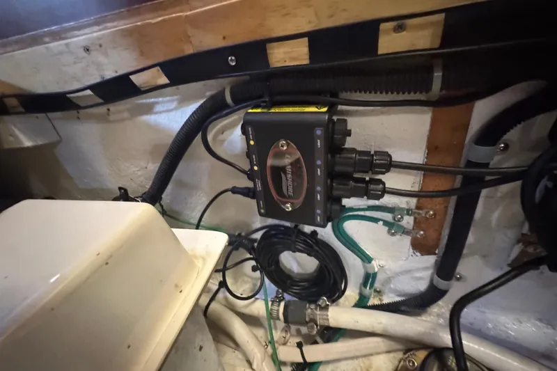 Slide: The Image of Electrical system inside a 2012 Hylas 49CC boat, featuring wiring and connectors. - 207